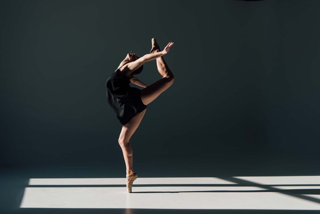 beautiful-young-ballerina-dancing-in-sunlight-AY2ZTKR.jpg