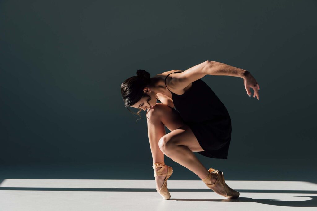 elegant-beautiful-ballerina-in-black-dress-dancing-JMMUADB.jpg